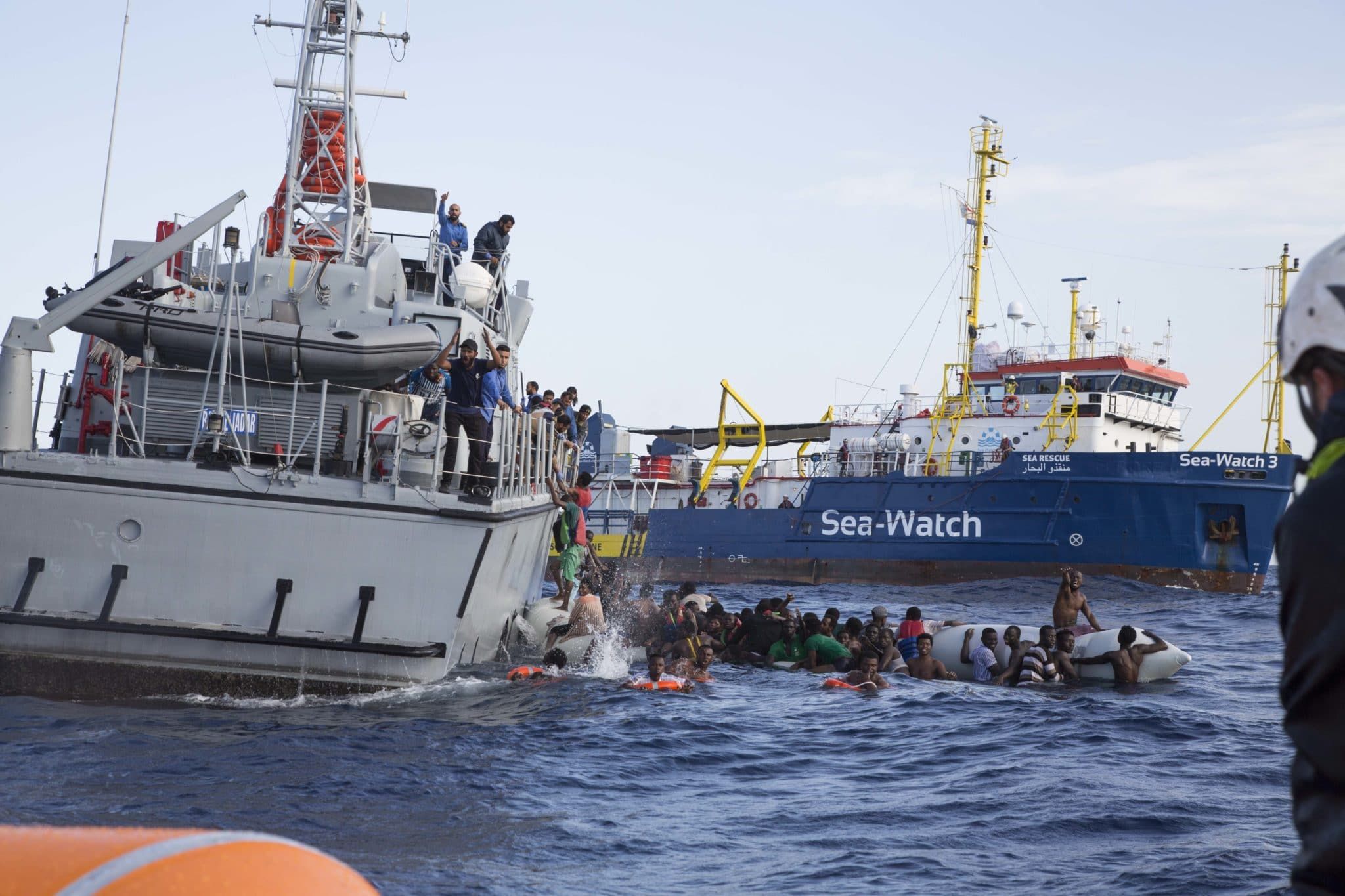 Photo of Libyan Coast Guard Ship, sinking refugee boat and Sea-Watch 3 by Lisa Hoffmann